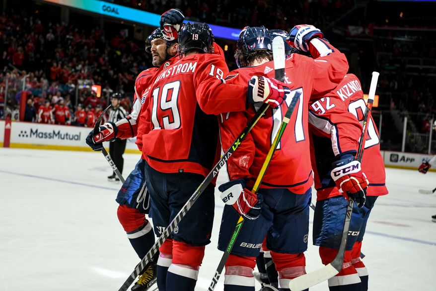 Capitals players celebrating Washington Capitals Center Evgeny Kuznetsov’s (92) 1st period goal against the Carolina Hurricanes at Capital One Arena in Washington D.C., March 3, 2022. (Photo by All-Pro Reels)