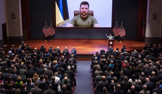Ukrainian President Volodymyr Zelenskyy speaks to the U.S. Congress by video to plead for support as his country is besieged by Russian forces, at the Capitol in Washington, Wednesday, March 16, 2022. (AP Photo/J. Scott Applewhite, Pool)