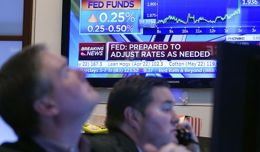 A television screen on the floor of the New York Stock Exchange, Wednesday, March 16, 2022, shows the rate decision of the Federal Reserve. The Fed&#x27;s quarter-point hike in its key rate, which it had pinned near zero since the pandemic recession struck two years ago, marks the start of its effort to curb the high inflation that has followed the recovery from the recession. (AP Photo/Richard Drew)