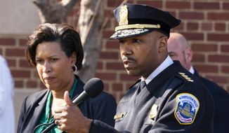 Washington Mayor Muriel Bowser, left, and Washington Metropolitan Police Chief Robert Contee III, speak during a news conference about the arrest of suspect in a recent string of attacks on homeless people, Tuesday, March 15, 2022, in Washington. A gunman suspected of stalking homeless people asleep on the streets of New York City and Washington, killing at least two people and wounding three others, was arrested early Tuesday, police said. (AP Photo/Alex Brandon) ** FILE **