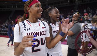 Howard&#39;s Brooklynn Fort-Davis (24) and Krislyn Marsh, right celebrate after a First Four game against Incarnate Word in the NCAA women&#39;s college basketball tournament Wednesday, March 16, 2022, in Columbia, S.C. (AP Photo/Sean Rayford)