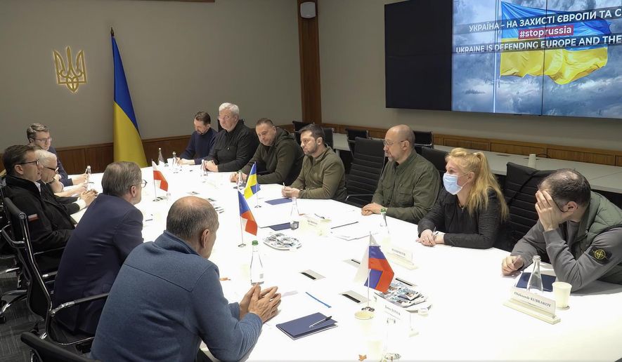 In this image from video provided by the Ukrainian Presidential Press Office, Ukrainian President Volodymyr Zelenskyy speaks during a meeting with Slovenia Prime Minister Janez Jansa, Czech Republic Prime Minister Petr Fiala, Polish Prime Minister Mateusz Morawiecki and Polish Deputy Prime Minister Jaroslaw Kaczynski on behalf of the European Council, in Kyiv, Ukraine, on Tuesday, March 15, 2022. (Ukrainian Presidential Press Office via AP)