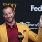 Washington Commanders NFL football team new quarterback Carson Wentz greets members of the media after being introduced by head coach Ron Rivera, a during a news conference in Ashburn, Va., Thursday, March 17, 2022. (AP Photo/Manuel Balce Ceneta)