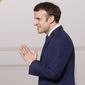French President Emmanuel Macron arrives to deliver a speech after a medal ceremony for childhood and families, at the Elysee Palace, in Paris, Wednesday, March 16, 2022. (Ian Langsdon, Pool via AP)