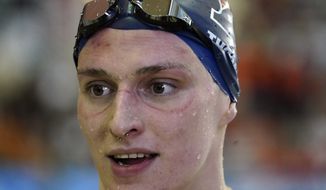 Pennsylvania&#39;s Lia Thomas does a television interview after winning the women&#39;s 500-yard freestyle at the NCAA swimming and diving championships Thursday, March 17, 2022, at Georgia Tech in Atlanta. Thomas is the first known transgender woman to win an NCAA swimming championship. (AP Photo/John Bazemore)