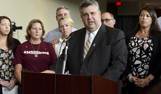 In this Aug. 9, 2018, file photo, Tony Montalto, father of Gina Rose, a victim of the Marjory Stoneman Douglas High School shooting, speaks during a news conference in Sunrise, Fla. Montalto, whose 14-year-old daughter Gina was killed, is president of &quot;Stand with Parkland,&quot; a group composed of parents and spouses of the victims. Montalto is surrounded by other family members of those killed. Parents of victims in Florida&#39;s 2018 high school massacre say they are glad to see the federal government reach a $127.5 million settlement over FBI inaction in the case, and hope a future tragedy can be prevented. (Taimy Alvarez/South Florida Sun-Sentinel via AP, File)
