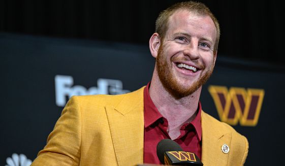 Washington Commanders quarterback Carson Wentz speaks with reporters during his introductory press conference at Inova Sports Performance Center in Ashburn, Va., March 17, 2022. (Photo by Brian Murphy, All-Pro Reels)