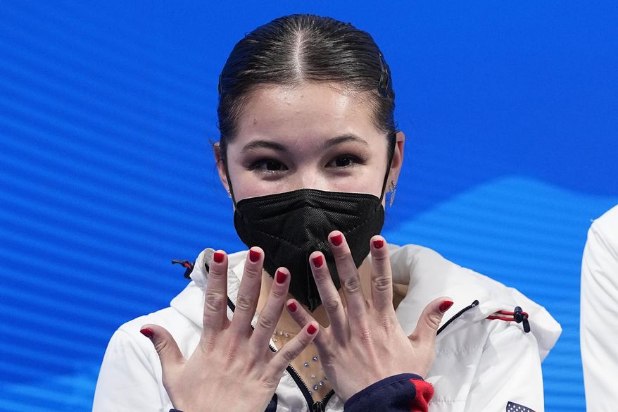Alysa Liu, of the United States, reacts after competing in the women&#39;s free skate program during the figure skating competition at the Winter Olympics on Feb. 17, 2022, in Beijing. U.S. Olympic figure skater Alysa Liu and her father Arthur Liu — a former political refugee — were among those targeted in a spying operation that the Justice Department alleges was ordered by the Chinese government, the elder Liu said late Wednesday, March 16. (AP Photo/David J. Phillip, File)