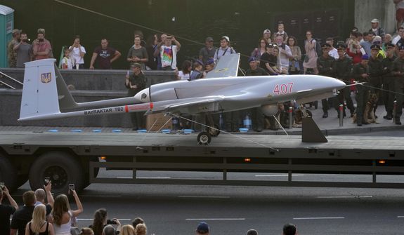 In this file photo, a Turkish-made Bayraktar TB2 drone is displayed during a rehearsal of a military parade dedicated to Independence Day in Kyiv, Ukraine, Aug. 20, 2021. The drones, which carry lightweight, laser-guided bombs, carried out unexpectedly successful attacks in the early stages of Ukraine&#39;s conflict with Russia. But that edge is rapidly evaporating, researchers and military observers say, as fresh Russian anti-drone systems arriving on the front lines of the bloody slog in the eastern Donbas region are making the unmanned craft far less effective. (AP Photo/Efrem Lukatsky, File)  **FILE**