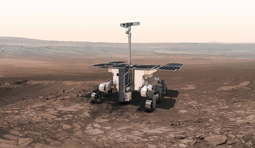 This undated artist rendition provided by the European Space Agency shows the ESA ExoMars robot on Mars. Because of the Russian invasion of Ukraine, Europe will no longer be attempting to send its first rover to Mars this year. The European Space Agency confirmed Thursday March 17, 2022 that it is indefinitely suspending its ExoMars rover mission with partner Roscosmos, Russia's state space corporation. (Thiebaut/ESA-AOES medialab via AP)