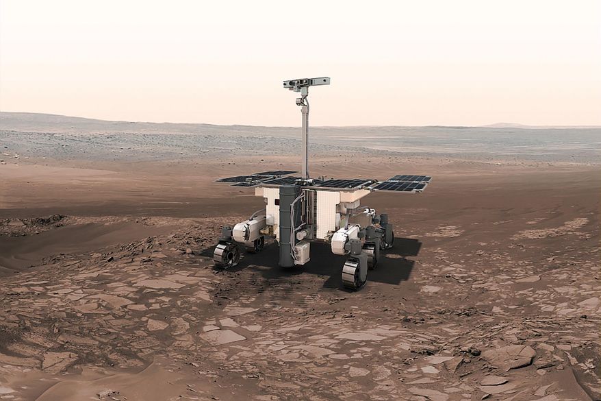This undated artist rendition provided by the European Space Agency shows the ESA ExoMars robot on Mars. Because of the Russian invasion of Ukraine, Europe will no longer be attempting to send its first rover to Mars this year. The European Space Agency confirmed Thursday March 17, 2022 that it is indefinitely suspending its ExoMars rover mission with partner Roscosmos, Russia's state space corporation. (Thiebaut/ESA-AOES medialab via AP)