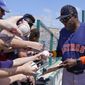 Houston Astros manager Dusty Baker signs autographs for fans before a spring training baseball game against the St. Louis Cardinals, Friday, March 18, 2022, in Jupiter, Fla. (AP Photo/Sue Ogrocki)