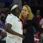 Maryland head coach Brenda Frese, right, talks with guard Ashley Owusu during the second half of a college basketball game against Delaware in the first round of the NCAA tournament, Friday, March 18, 2022, in College Park, Md. Maryland won 102-71. (AP Photo/Julio Cortez)