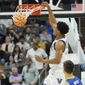 Villanova&#39;s Jermaine Samuels, top, dunks past Delaware&#39;s Dylan Painter during the first half of a college basketball game in the first round of the NCAA tournament, Friday, March 18, 2022, in Pittsburgh. (AP Photo/Keith Srakocic)