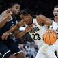 Purdue&#39;s Jaden Ivey drives past Yale&#39;s Matthue Cotton during the second half of a first round NCAA college basketball tournament game Friday, March 18, 2022, in Milwaukee. (AP Photo/Morry Gash)