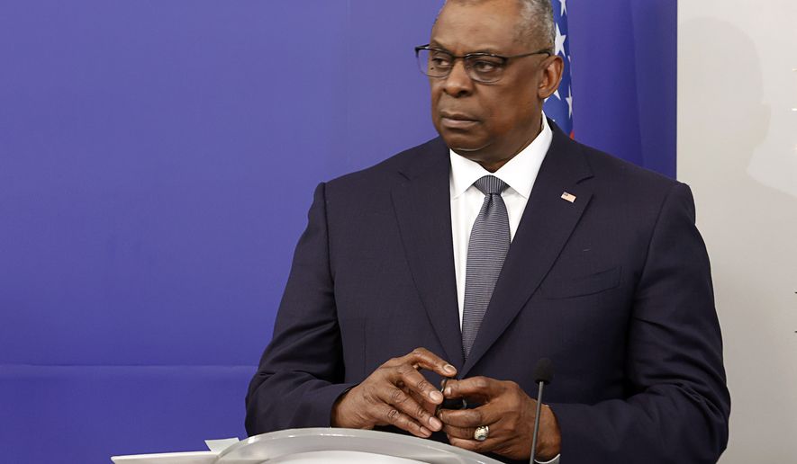 U.S. Secretary of Defense Lloyd Austin reacts during joint news conference with Bulgarian Prime Minister in the Council of Ministers, Sofia, Saturday, March 19, 2022. This is the first visit of the US Secretary of Defense to Bulgaria in the last 25 years. (AP Photo/Valentina Petrova)
