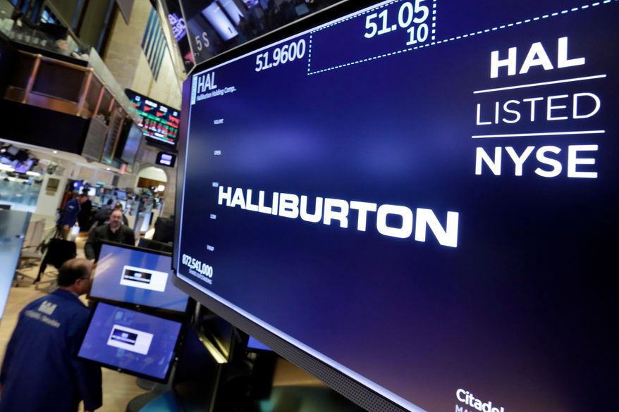The logo for Halliburton appears above a trading post on the floor of the New York Stock Exchange, Monday, April 23, 2018. U.S. oil field services companies Halliburton Co. and Schlumberger are suspending their operations in Russia as the Houston, Texas-based businesses react to U.S. sanctions over Russia’s invasion of Ukraine. (AP Photo/Richard Drew) **FILE**