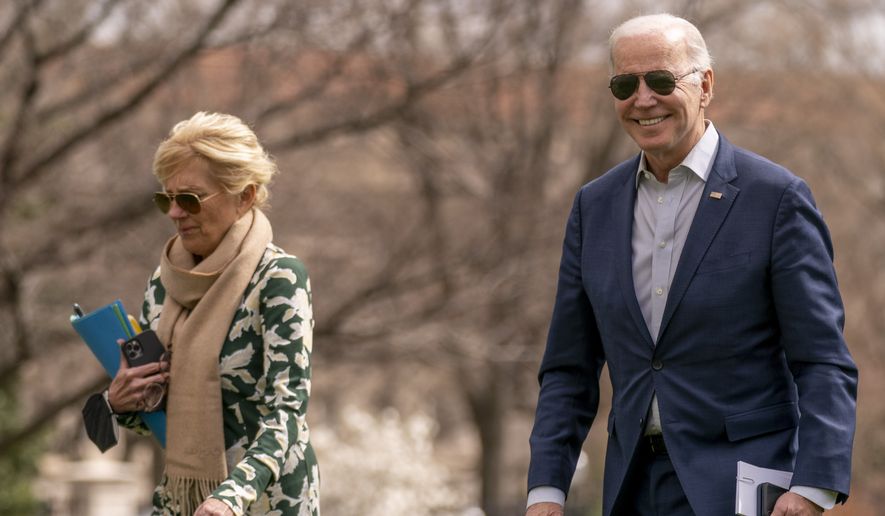 President Joe Biden and first lady Jill Biden arrive at the White House in Washington, Sunday, March 20, 2022, after spending the weekend in Rehoboth Beach, Del. (AP Photo/Andrew Harnik)