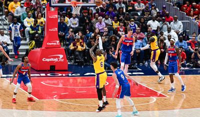 LeBron James (6) ties the record for 2nd most points by an NBA player on this three point shot over Wizards defender Deni Avdija (9) from Washington Wizards vs. Los Angeles Lakers at Capital One Arena, March 19th, 2022 (Joe Glorioso | Washington Times Sports)