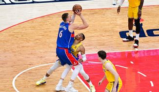 Wizards center Kristaps Porzingis shoots right over Lakers guard Russell Westbrook (0) from Washington Wizards vs. Los Angeles Lakers at Capital One Arena, March 19th, 2022 (Joe Glorioso | Washington Times Sports)