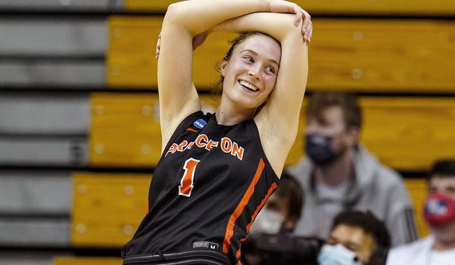Princeton guard Abby Meyers (1) celebrates in the second half of a college basketball game against Kentucky in the first round of the NCAA tournament in Bloomington, Ind., Saturday, March 19, 2022. Princeton defeated Kentucky 69-62. (AP Photo/Michael Conroy)