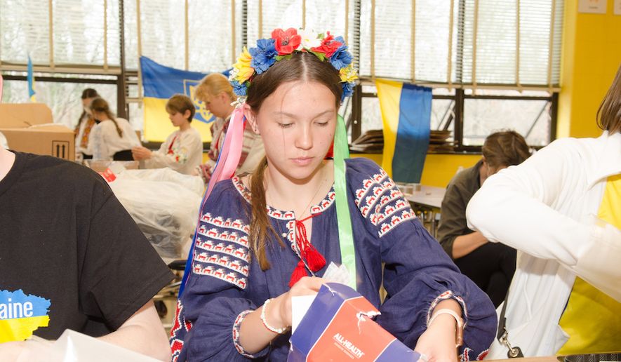 Ukrainian Scout Ivanka Charchalis, 15, helps pack an emergency medical kit at Westland Middle School in Bethesda on March 19, 2022. (Photo courtesy of Yuri Huta)