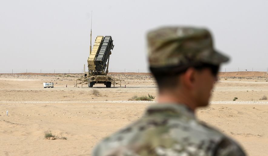 A member of the U.S. Air Force stands near a Patriot missile battery at the Prince Sultan air base in al-Kharj, central Saudi Arabia, on Feb. 20, 2020. The U.S. has transferred a significant number of Patriot antimissile interceptors to Saudi Arabia in recent weeks as the Biden administration looks to ease what has been a point of tension in the increasingly complicated U.S.-Saudi relationship. (Andrew Caballero-Reynolds/Pool via AP) **FILE**