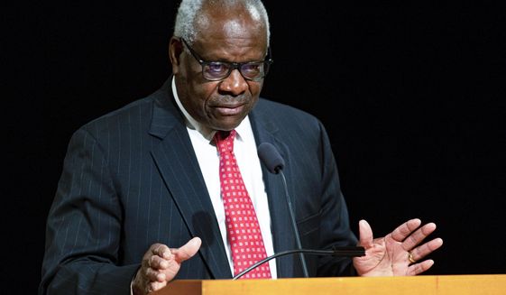 FILE - U.S. Supreme Court Associate Clarence Thomas speaks at the University of Notre Dame in South Bend, Ind., on Sept. 16, 2021. Thomas has been hospitalized because of an infection, the Supreme Court said Sunday, March 20, 2022. Thomas, 73, has been at Sibley Memorial Hospital in Washington, D.C., since Friday, March 18 after experiencing “flu-like symptoms,” the court said in a statement. (Robert Franklin/South Bend Tribune via AP, File)