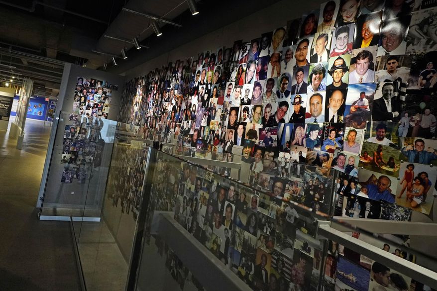 Photos of people who died in the Sept. 11, 2001, World Trade Center attacks are displayed at the 9/11 Tribute Museum, in New York, Monday, March 21, 2022. (AP Photo/Richard Drew) ** FILE **