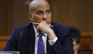 Sen. Cory Booker, D-N.J., listens as Supreme Court nominee Ketanji Brown Jackson testifies during her Senate Judiciary Committee confirmation hearing on Capitol Hill in Washington, Tuesday, March 22, 2022. (AP Photo/Alex Brandon)