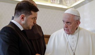 In this Saturday, Feb. 8, 2020, file photo, Pope Francis exchanges gifts with Ukrainian President Volodymyr Zelenskyy, left, during a private audience at the Vatican. Zelenskyy said during a video conference with the Italian parliament, Tuesday, March 22, 2022, that he has talked with Pope Francis earlier in the morning. (AP Photo/Gregorio Borgia, Pool)