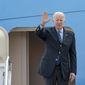 President Joe Biden waves as he boards Air Force One at Andrews Air Force Base, Md., Wednesday, March 23, 2022. Biden is traveling to Europe to meet with World counterparts on Russia&#39;s invasion of Ukraine. (AP Photo/Gemunu Amarasinghe)