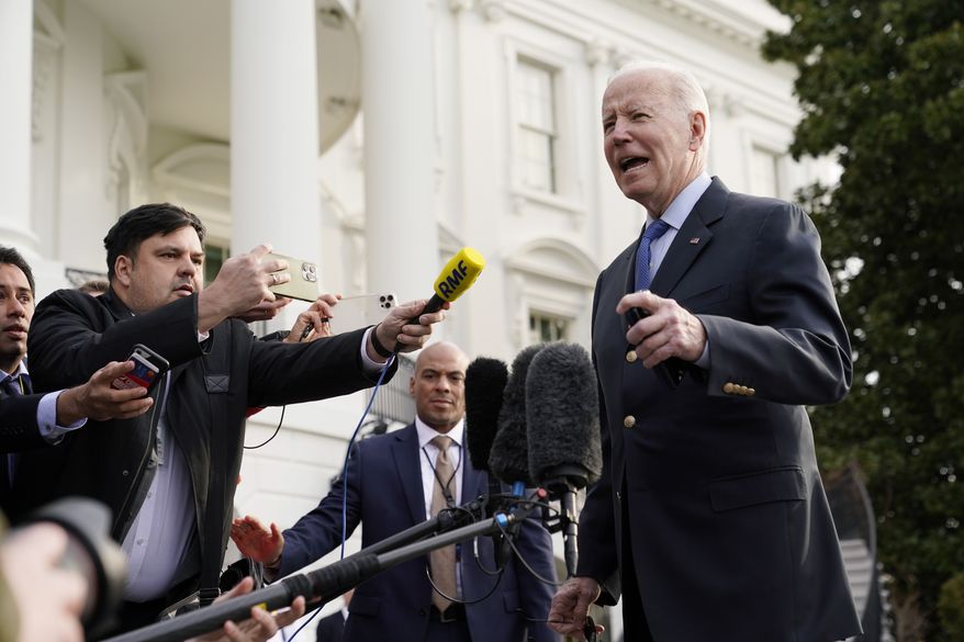 President Joe Biden speaks with members of the press before boarding Marine One on the South Lawn of the White House, Wednesday, March 23, 2022, in Washington. Biden is traveling to Europe to meet with World counterparts on Russia's invasion of Ukraine. (AP Photo/Patrick Semansky)