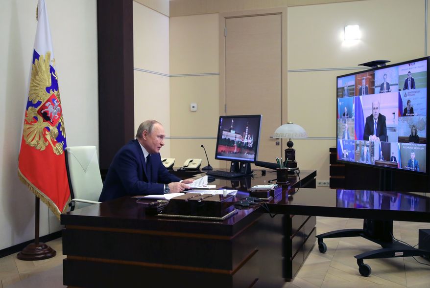Russian President Vladimir Putin attends a cabinet meeting via videoconference at the Novo-Ogaryovo residence outside Moscow, Russia, Wednesday, March 23, 2022. (Mikhail Klimentyev, Sputnik, Kremlin Pool Photo via AP)