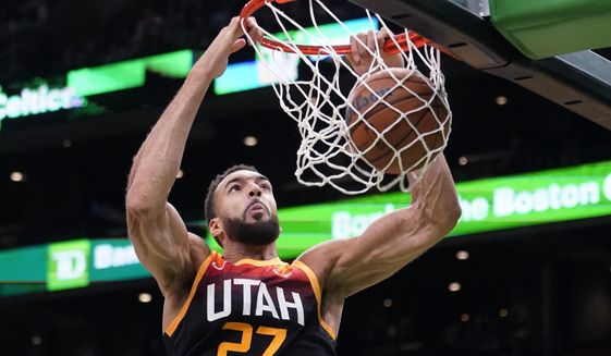 Utah Jazz center Rudy Gobert dunks during the first half of the team&#39;s NBA basketball game against the Boston Celtics, Wednesday, March 23, 2022, in Boston. (AP Photo/Charles Krupa)