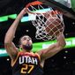 Utah Jazz center Rudy Gobert dunks during the first half of the team&#39;s NBA basketball game against the Boston Celtics, Wednesday, March 23, 2022, in Boston. (AP Photo/Charles Krupa)