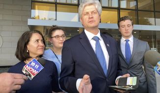 U.S. Rep. Jeff Fortenberry, R-Neb., center, speaks with the media outside the federal courthouse in Los Angeles, Thursday, March 22, 2022. Fortenberry was convicted Thursday of charges that he lied to federal authorities about an illegal $30,000 contribution to his campaign from a foreign billionaire at a 2016 Los Angeles fundraiser. (AP Photo/Brian Melley)