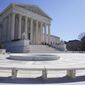 People stand on the steps of the U.S. Supreme Court, Feb.11, 2022, in Washington.  (AP Photo/Mariam Zuhaib, File)  **FILE**