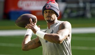 FILE - Houston Texans quarterback Deshaun Watson warms up before an NFL football game against the Tennessee Titans Sunday, Jan. 3, 2021, in Houston. Deshaun Watson stepped away from legal depositions and allegations of sexual misconduct on Thursday, March 24, 2022, to meet his new team. Watson arrived at Cleveland&#39;s headquarters in Berea, Ohio, the first step for him and a franchise investing in a player who has been accused by 22 women of sexual misconduct. (AP Photo/Eric Christian Smith, File)