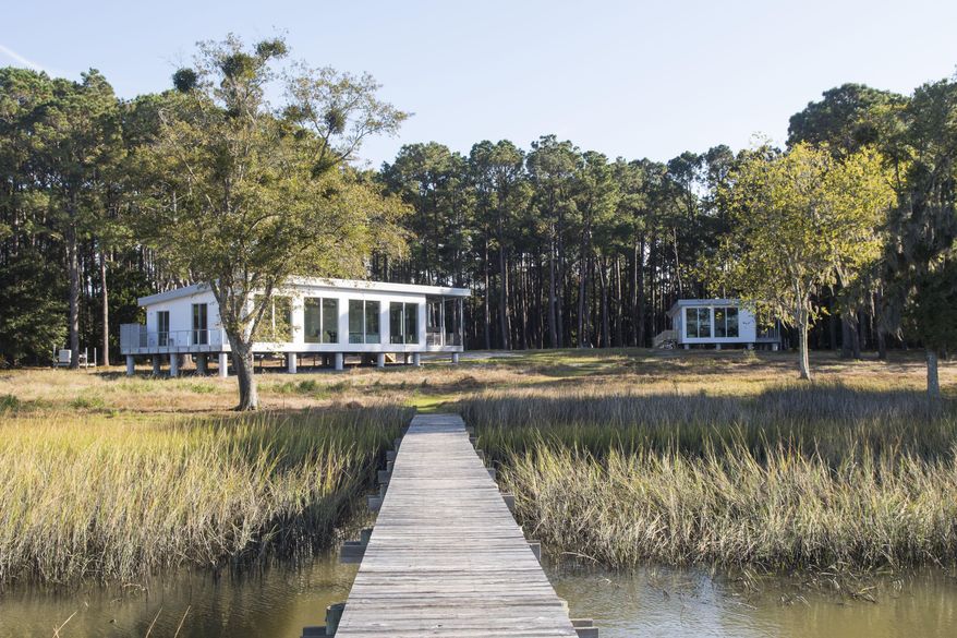 This image provided by Bigger Than Tiny, Smaller Than Average, is an example of an Accessory Dwelling Unit, a small home separate from a main house. Proponents say ADUs are a low-impact, energy-efficient way to create more living space. (Tripp Smith Photography for Bigger Than Tiny, Smaller Than Average via AP)
