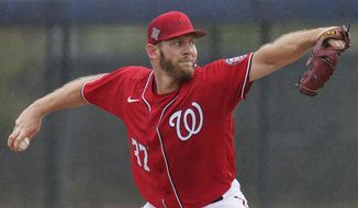 Washington Nationals pitcher Stephen Strasburg throws live batting practice in a drizzle during the team&#39;s spring training baseball workout, Tuesday, March 15, 2022, in West Palm Beach, Florida. (AP Photo/Sue Ogrocki) **FILE**