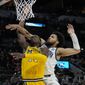 Villanova guard Caleb Daniels, right, fouls Michigan forward Moussa Diabate during the second half of a college basketball game in the Sweet 16 round of the NCAA tournament on Thursday, March 24, 2022, in San Antonio. (AP Photo/Eric Gay)