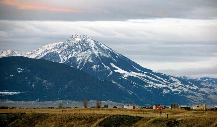 FILE - Emigrant Peak towers over the Paradise Valley in Montana north of Yellowstone National Park, on Nov. 21, 2016. Park County authorities said Friday, March 25, 2022, that a hiker was killed in the area in a suspected encounter with a grizzly bear. (AP Photo/Matthew Brown, File)