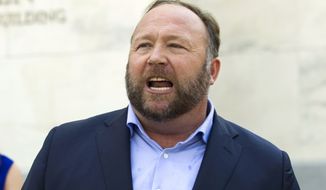 FILE - Infowars host Alex Jones speaks outside of the Dirksen building on Capitol Hill on Sept. 5, 2018, in Washington. Lawyers for relatives of Sandy Hook Elementary School shooting victims asked a Connecticut judge again Friday, March 25, 2022, to order the arrest of Jones, after he defied a court order to attend a deposition as part of a lawsuit over his calling the massacre a hoax. (AP Photo/Jose Luis Magana, File)