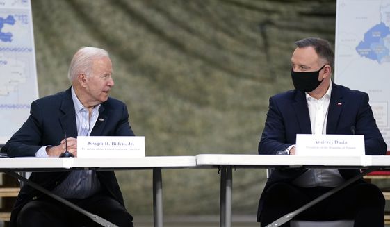 President Joe Biden and Polish President Andrzej Duda participate in a roundtable on the humanitarian response to the Russian invasion of Ukraine, Friday, March 25, 2022, in Jasionka, Poland. (AP Photo/Evan Vucci)