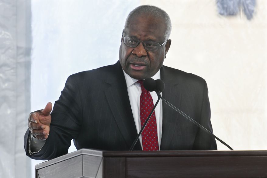 Supreme Court Justice Clarence Thomas delivers a keynote speech during a dedication of Georgia new Nathan Deal Judicial Center in Atlanta, Feb. 11, 2020. Reports that the wife of Thomas implored Donald Trumps White House chief of staff to act to overturn the 2020 election results has put a spotlight on how justices decide whether to step aside from a case. (AP Photo/John Amis, File)