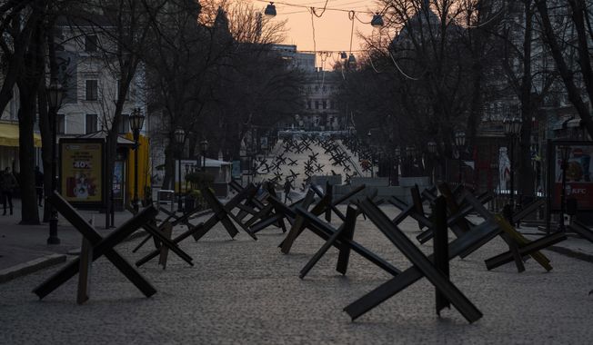 Anti- tank barricades are placed on a street as preparation for a possible Russian offensive, in Odesa, Ukraine, Thursday March 24, 2022.(AP Photo/Petros Giannakouris)