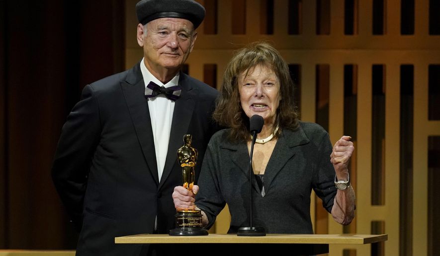 Bill Murray, left, presents Elaine May with an honorary award at the Governors Awards on Friday, March 25, 2022, at the Dolby Ballroom in Los Angeles. (AP Photo/Chris Pizzello)