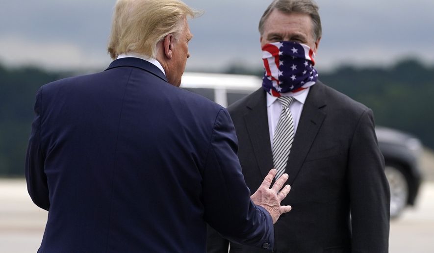 FILE - President Donald Trump greets then-Sen. David Perdue, R-Ga., as he arrives at Dobbins Air Reserve Base for a campaign event Sept. 25, 2020, in Atlanta. Trump wants to use November&#39;s midterm elections to solidify his continued dominance of the national Republican Party. Few places are more central to that effort than Georgia. Enraged that Republican Gov. Brian Kemp didn&#39;t advance lies that the state&#39;s free and fair presidential election was stolen, Trump recruited former Sen. David Perdue to run against him in the May 24 primary. (AP Photo/Evan Vucci, File)