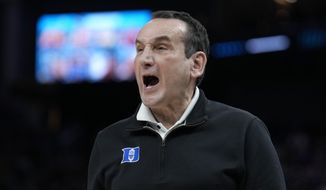 Duke head coach Mike Krzyzewski reacts toward players during the first half of his team&#39;s college basketball game against Arkansas in the Elite 8 round of the NCAA men&#39;s tournament in San Francisco, Saturday, March 26, 2022. (AP Photo/Tony Avelar)